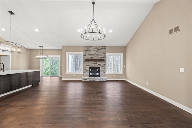 4070 Metamora Rdg, Metamora, MI 48455 - unfurnished living room featuring a notable chandelier, visible vents, and plenty of natural light