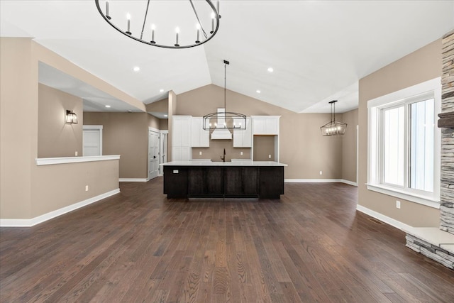 4070 Metamora Rdg, Metamora, MI 48455 - kitchen with a large island, white cabinets, a notable chandelier, light countertops, and lofted ceiling
