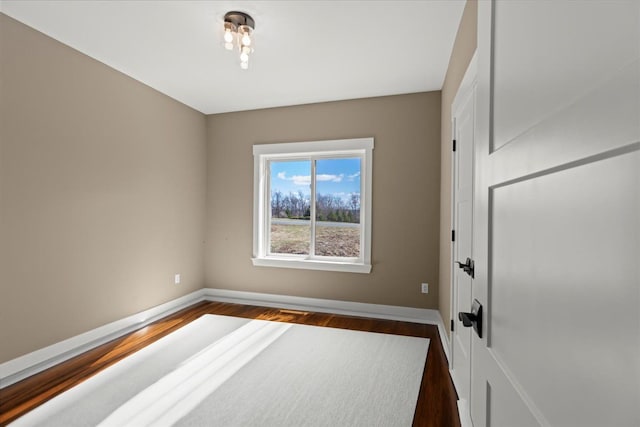 4070 Metamora Rdg, Metamora, MI 48455 - interior space featuring dark wood-style flooring and baseboards