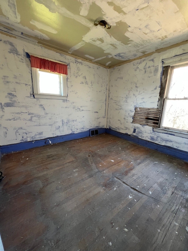 190 W Buena Vista St, Highland Park, MI 48203 - empty room with visible vents and hardwood / wood-style flooring
