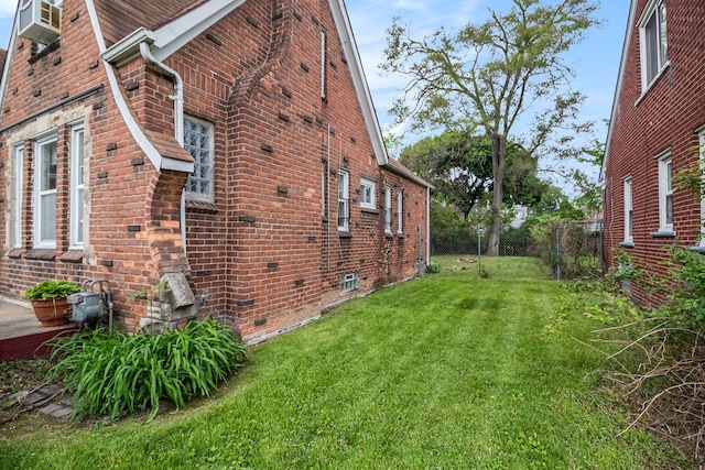view of property exterior featuring brick siding