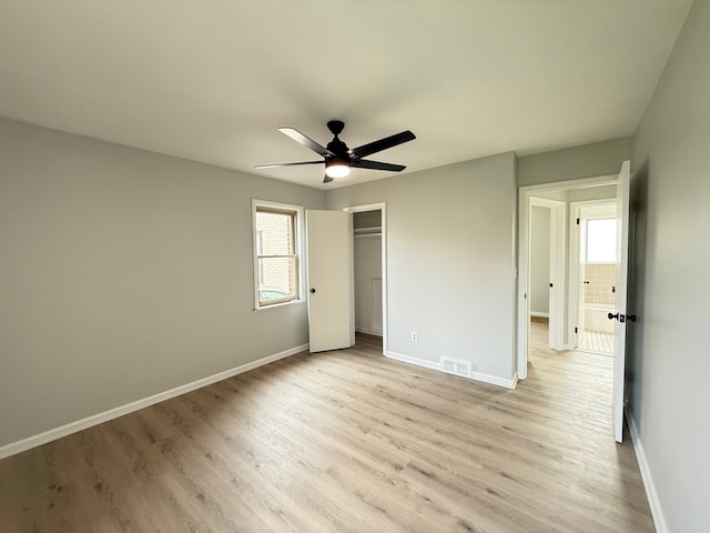unfurnished bedroom featuring visible vents, baseboards, and light wood-style floors