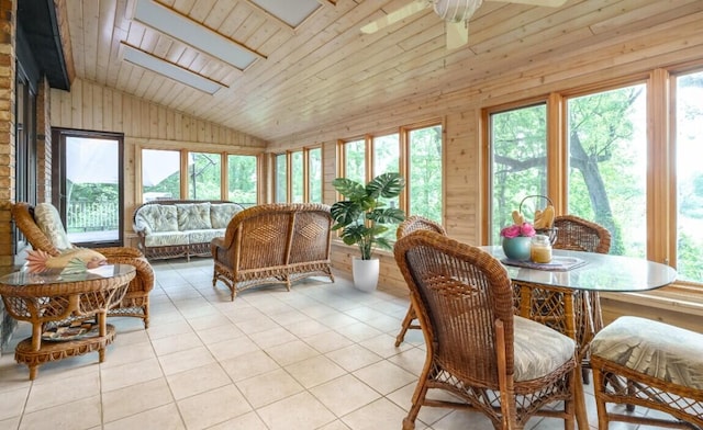 9420 Whim Trl, Richland, MI 49083 - sunroom / solarium featuring tile patterned floors, lofted ceiling with skylight, wooden walls, and wooden ceiling