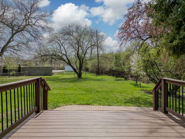 deck featuring fence and a lawn