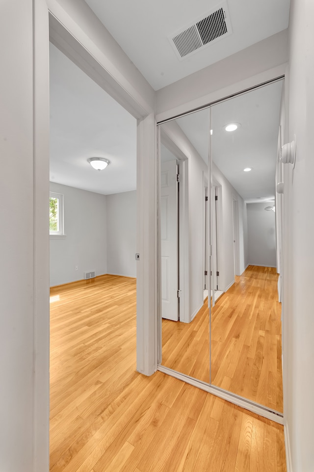 interior space with recessed lighting, visible vents, and wood finished floors