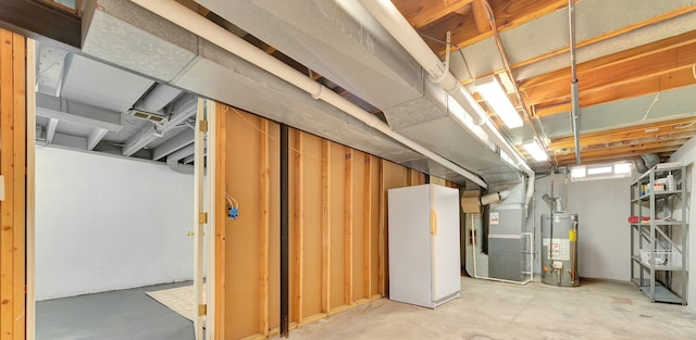below grade area featuring heating unit and water heater