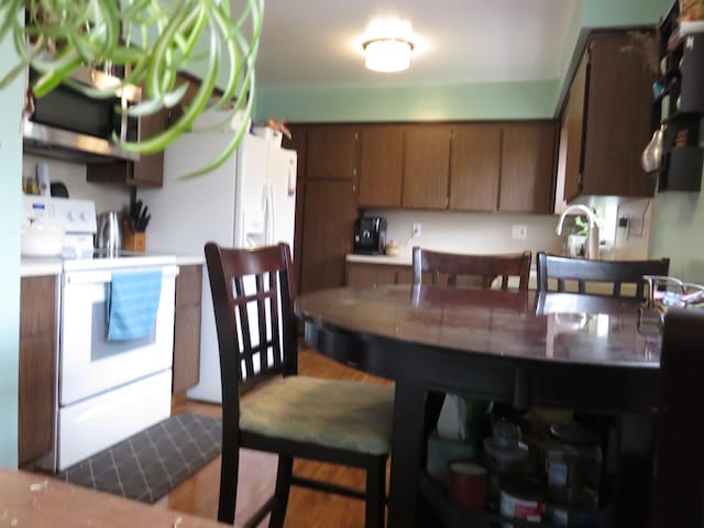 5900 Commerce Rd, West Bloomfield, MI 48324 - kitchen featuring white range with electric stovetop and a sink