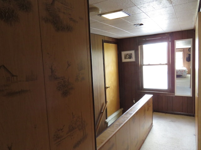 5900 Commerce Rd, West Bloomfield, MI 48324 - hall featuring wooden walls and light colored carpet
