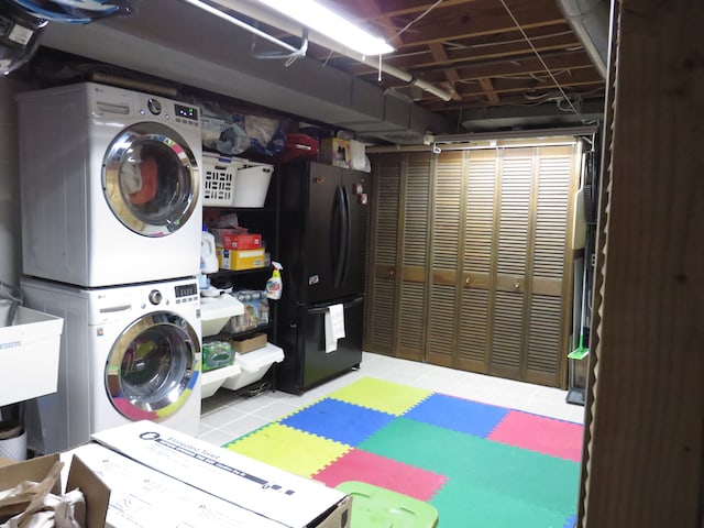 5900 Commerce Rd, West Bloomfield, MI 48324 - laundry area with stacked washer / dryer and laundry area