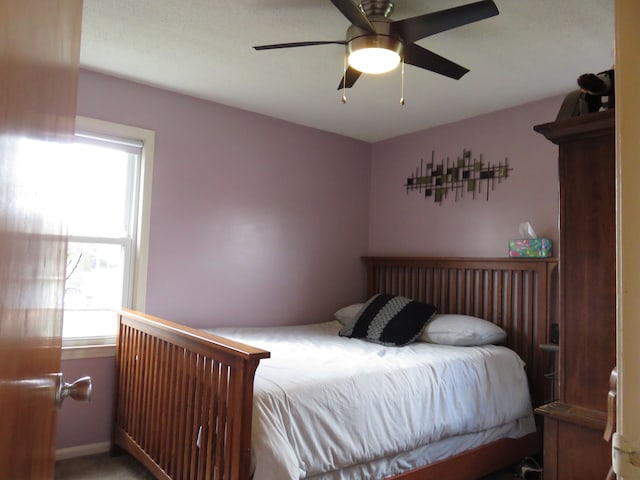 5900 Commerce Rd, West Bloomfield, MI 48324 - bedroom with baseboards and ceiling fan