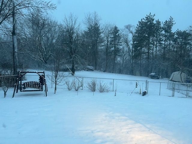 5900 Commerce Rd, West Bloomfield, MI 48324 - snowy yard featuring fence