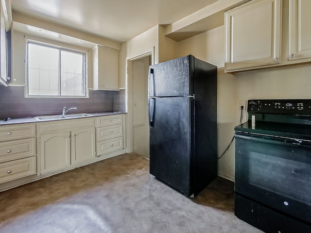 kitchen featuring black appliances, a sink, cream cabinets, and light carpet