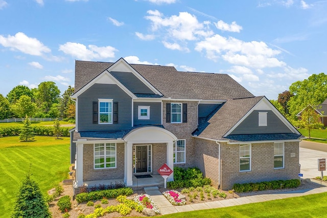 13268 Cousin, Washington, MI 48094 - traditional-style house with a front yard, brick siding, and a shingled roof