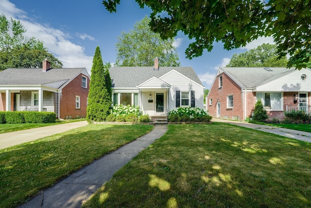 3015 N Wilson Ave, Royal Oak, MI 48073 - bungalow featuring brick siding, a front lawn, and a chimney