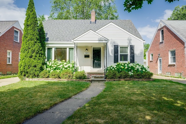 3015 N Wilson Ave, Royal Oak, MI 48073 - bungalow-style house featuring a shingled roof, a chimney, and a front yard