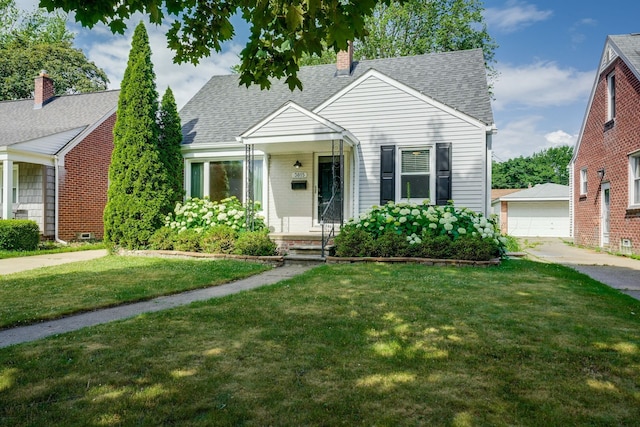 3015 N Wilson Ave, Royal Oak, MI 48073 - view of front of property featuring roof with shingles, a detached garage, an outbuilding, a front lawn, and a chimney