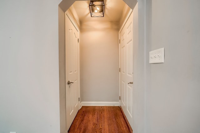3015 N Wilson Ave, Royal Oak, MI 48073 - hallway with arched walkways, baseboards, and wood finished floors