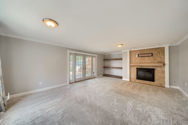3015 N Wilson Ave, Royal Oak, MI 48073 - unfurnished living room with french doors, crown molding, light carpet, baseboards, and a tile fireplace