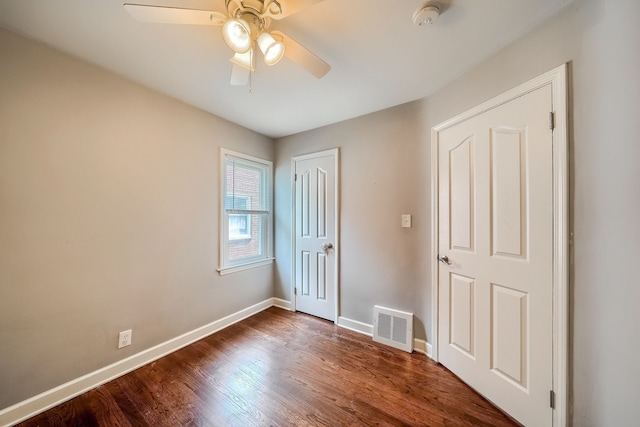 3015 N Wilson Ave, Royal Oak, MI 48073 - unfurnished bedroom featuring wood finished floors, visible vents, baseboards, and a ceiling fan