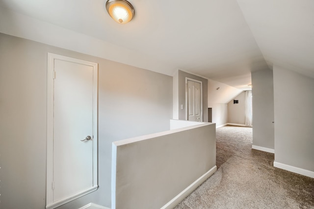 3015 N Wilson Ave, Royal Oak, MI 48073 - corridor with lofted ceiling, baseboards, an upstairs landing, and carpet floors