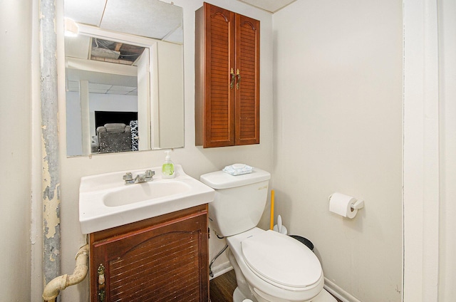 28291 Suburban Dr, Warren, MI 48088 - bathroom with toilet, vanity, and baseboards