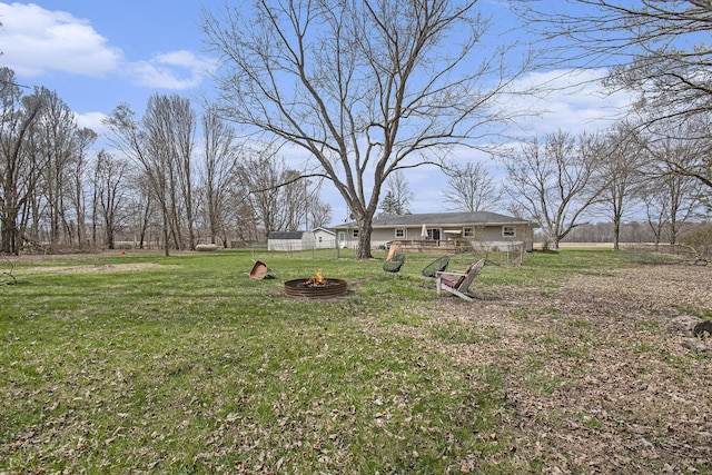 view of yard featuring a fire pit
