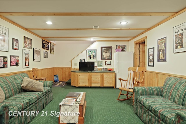 living area featuring wood walls, carpet flooring, wainscoting, and beamed ceiling