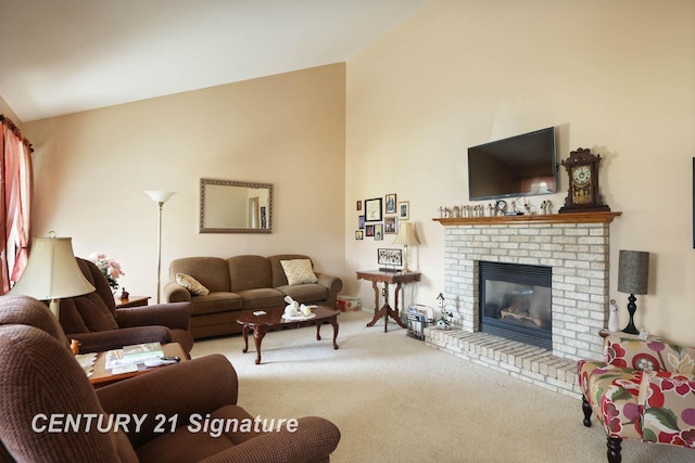 living area with carpet flooring, a brick fireplace, and lofted ceiling