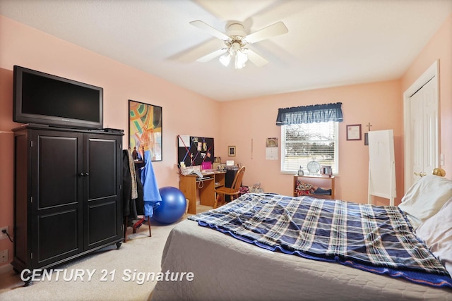 bedroom with a ceiling fan and light colored carpet
