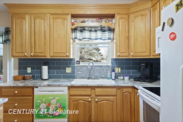 kitchen featuring decorative backsplash, a sink, and white appliances