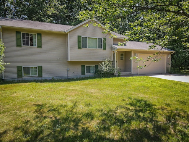 8594 S Felch Ave, Newaygo, MI 49337 - split level home featuring driveway, a garage, and a front lawn