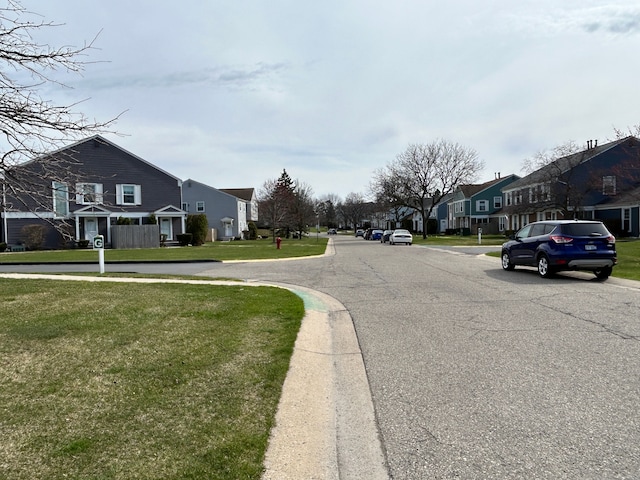 view of road featuring curbs and a residential view