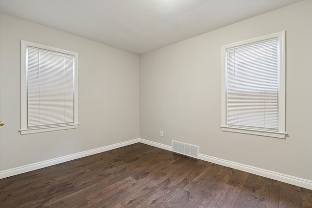 4677 Chatsworth St, Detroit, MI 48224 - unfurnished room with baseboards, dark wood-type flooring, and visible vents