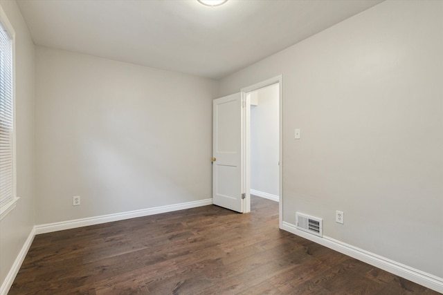 4677 Chatsworth St, Detroit, MI 48224 - empty room featuring baseboards, visible vents, and dark wood finished floors