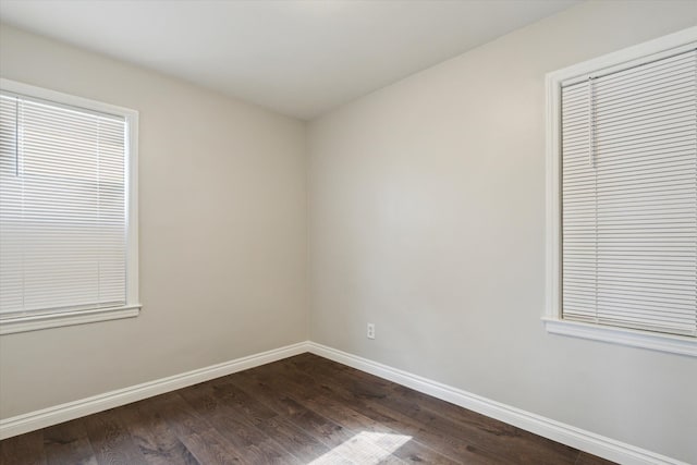 4677 Chatsworth St, Detroit, MI 48224 - unfurnished room with baseboards and dark wood-style floors
