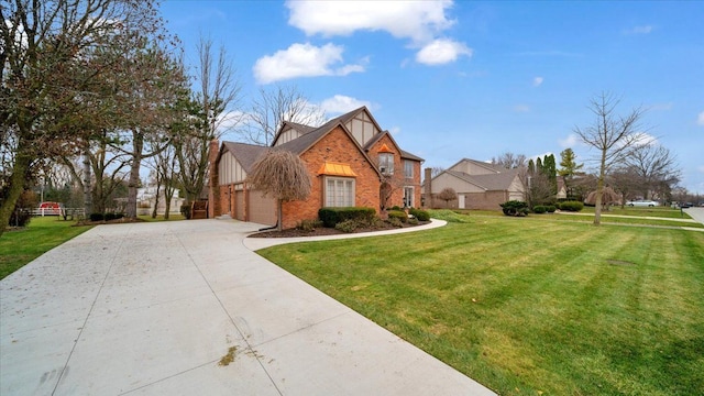 view of front of house with concrete driveway, brick siding, a garage, board and batten siding, and a front yard