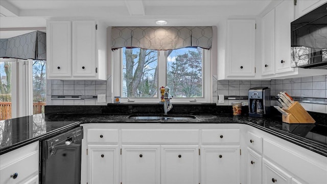 kitchen with backsplash, white cabinetry, a sink, and black appliances
