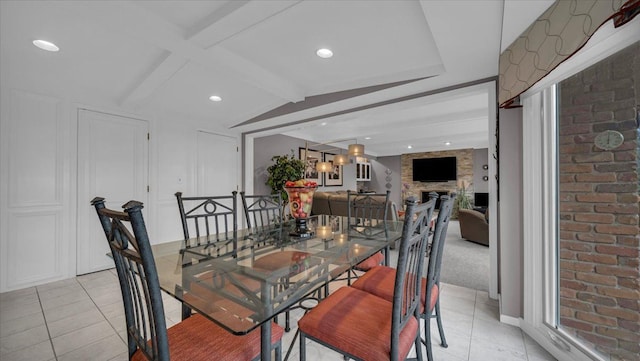 dining space featuring recessed lighting, a decorative wall, vaulted ceiling with beams, and light tile patterned floors
