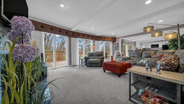 living area featuring carpet flooring, beamed ceiling, and recessed lighting