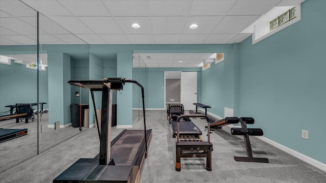 exercise area with baseboards, a paneled ceiling, carpet flooring, and recessed lighting