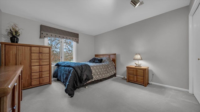 bedroom featuring baseboards, visible vents, and carpet