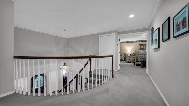 hall with baseboards, carpet, recessed lighting, and ornamental molding