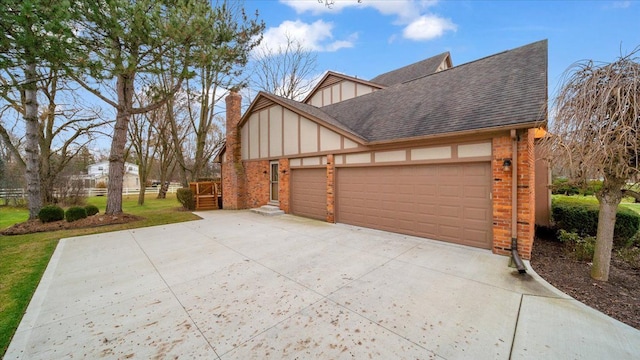view of home's exterior featuring an attached garage, a shingled roof, driveway, and brick siding