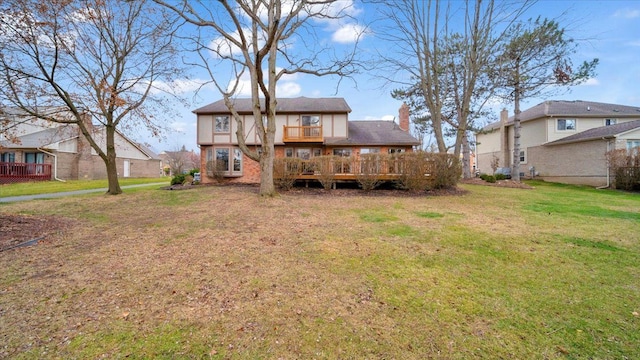 back of property with a lawn, a wooden deck, a residential view, and a chimney