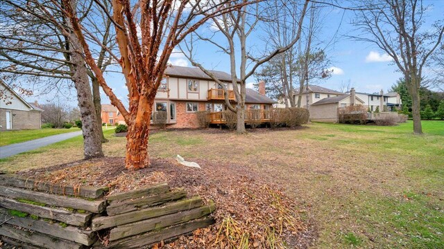 view of yard with a wooden deck and a residential view