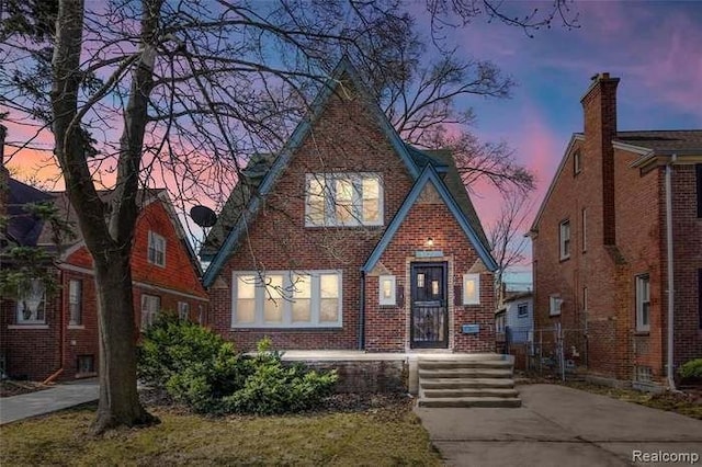 6127 Grayton St, Detroit, MI 48224 - tudor-style house featuring brick siding
