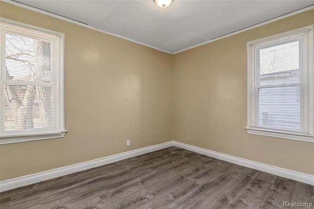 6127 Grayton St, Detroit, MI 48224 - spare room with wood finished floors, baseboards, and ornamental molding