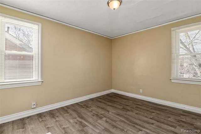 6127 Grayton St, Detroit, MI 48224 - unfurnished room with wood finished floors, baseboards, and ornamental molding