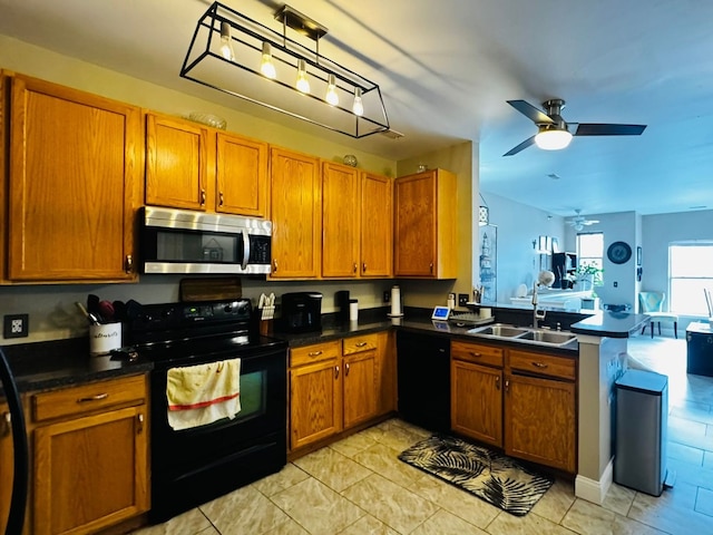 207 Legato Dr, Walled Lake, MI 48390 - kitchen featuring black appliances, a sink, a peninsula, brown cabinetry, and ceiling fan