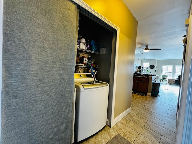 207 Legato Dr, Walled Lake, MI 48390 - laundry room with washer / dryer, ceiling fan, and baseboards